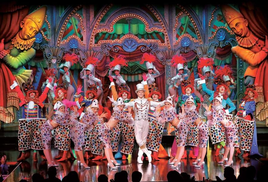 Paris: Moulin Rouge Dinner Show, Champagne, and Transport - Champagne, costumes, and the famous red windmill